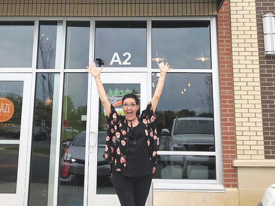 Mary Beth outside new store.jpg